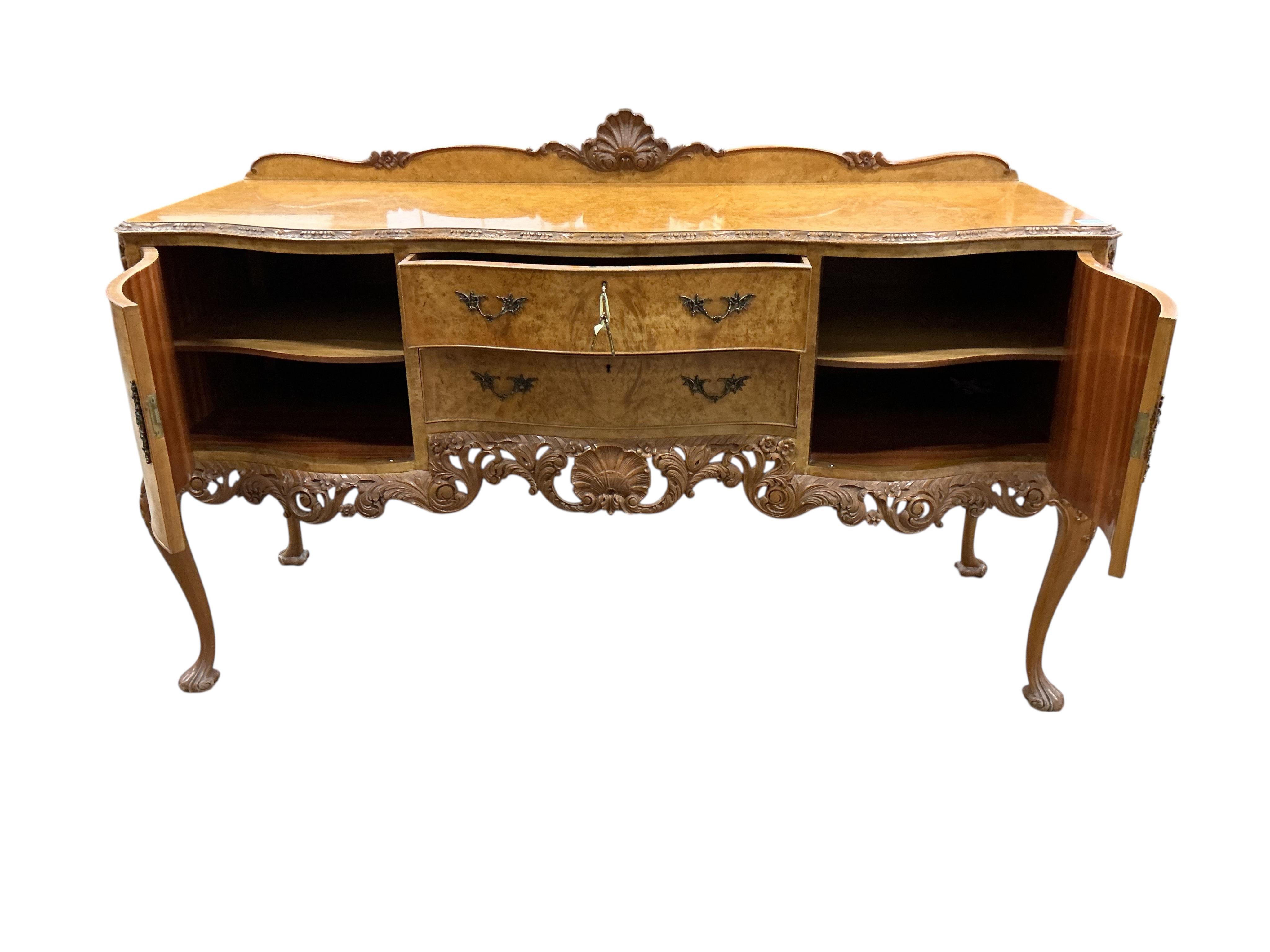 A Queen Anne Revival walnut serpentine sideboard, width 168cm, depth 60cm, height 91cm